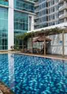 SWIMMING_POOL Warm 3BR Apartment at Ambassade Residences By Travelio