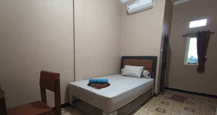 Bedroom SPOT ON 3525 Penginapan Magnolia Syariah