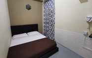Bedroom 2 SPOT ON 90042 One Plaza Eco Hotel