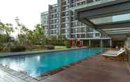 Swimming Pool 2 1BR Monochrome at Lexington Apartment By Travelio