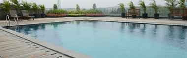 Swimming Pool 2 Studio Great Location at Tree Park Apartment By Travelio