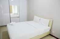 ห้องนอน Simply Spacious 1BR at Green Bay Condominium Apartment By Travelio