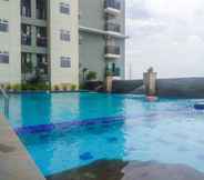 Swimming Pool 6 Minimalist 2BR Gading Greenhill Apartment By Travelio