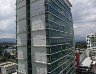 Bangunan 2 Studio Prime & Comfy @ Tamansari La Grande Apartment By Travelio