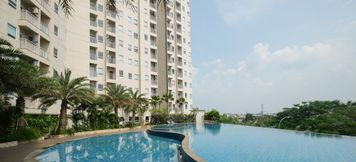 Swimming Pool 2 1BR Fully Furnished and Comfortable Mustika Golf Apartment By Travelio