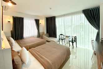Kamar Tidur 4 Tuan Ninh Hotel