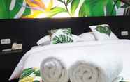 Bedroom 6 Tropical Point Hotel Syariah