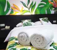 Bedroom 6 Tropical Point Hotel Syariah