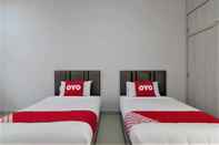 ห้องนอน Capital O 770 Baan Hom Hug Resort