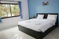 Kamar Tidur Happiness Garden Hotel