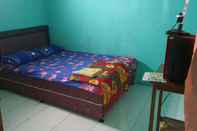ห้องนอน OYO 3969 Villa Bu Kris