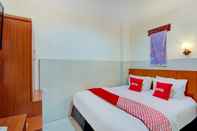 Kamar Tidur OYO 4011 58 Guesthouse