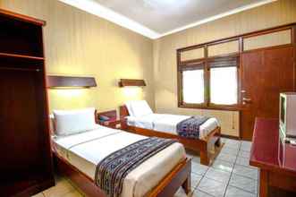 Kamar Tidur 4 Opulence Paradiso Beach Inn Hotel