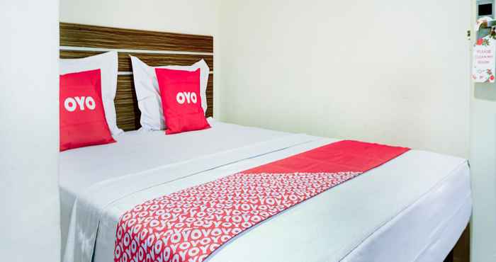 Kamar Tidur OYO 90002 Wisma Robinson