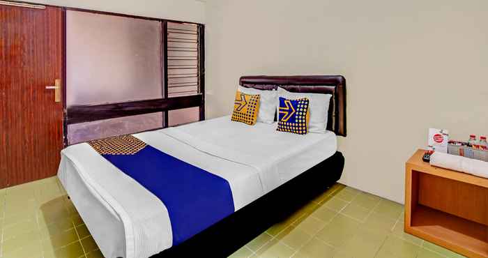 Kamar Tidur SPOT ON 90098 Anak Mama Guesthouse