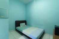 Kamar Tidur OYO 90125 Beverly Hills Syariah