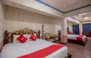 Kamar Tidur 3 OYO 738 Maganda Hotel