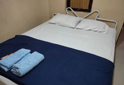 卧室 OYO 90251 Makaliwe Residence