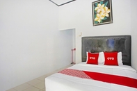 Kamar Tidur OYO 90229 Fidel Caestro Homestay