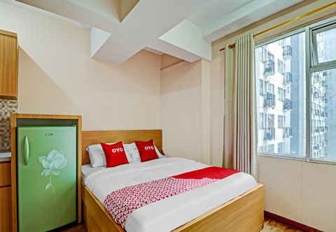 침실 OYO 90266 Jarrdin Apartement By Bedpacker