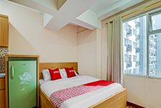 침실 OYO 90266 Jarrdin Apartement By Bedpacker