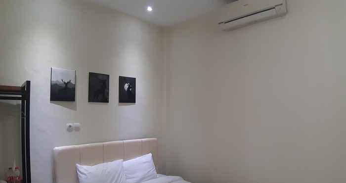 ห้องนอน OYO 90299 Corner Guest House