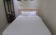 Kamar Tidur 6 OYO 90299 Corner Guest House