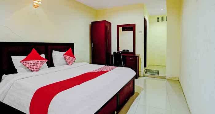 Phòng ngủ OYO 90331 Hotel Toba Shanda