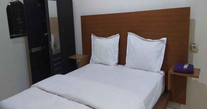 Kamar Tidur OYO 90334 Gloria Homestay