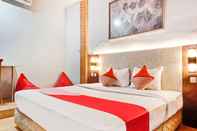 Bedroom OYO 90314 Stadion Guesthouse Syariah