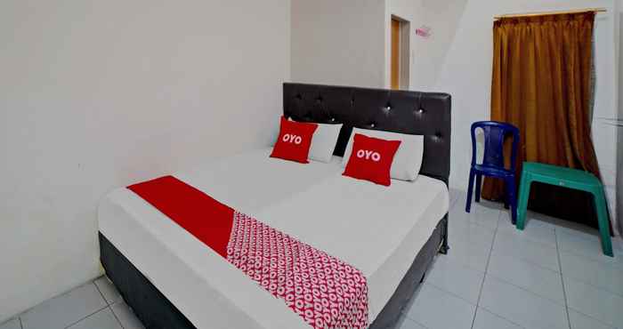 Bedroom OYO 90355 Darussalam Inn