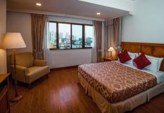 卧室 4 Garden View Court Suites