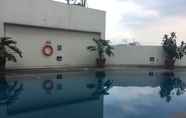 Swimming Pool 7 Comfy & Deluxe 2BR at Braga City Walk Apartment By Travelio