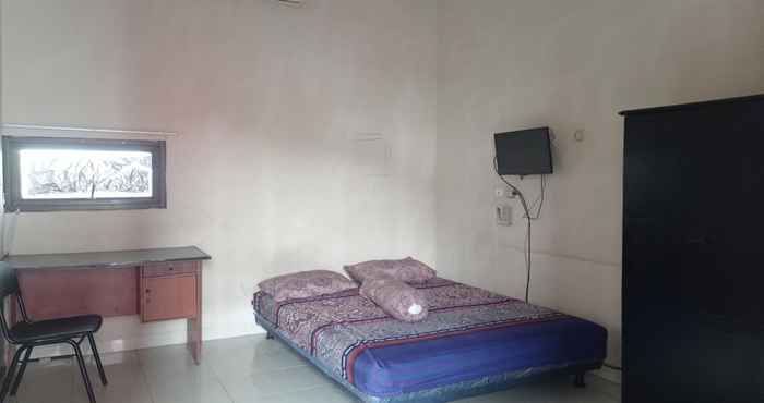 ห้องนอน OYO 90453 Padasuka Kost & Homestay