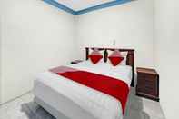 Bedroom OYO 90487 Wisma Kuta Karang Baru
