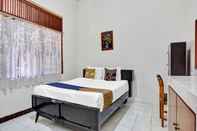 Bedroom SPOT ON 90539 Taman Borobudur Guest House Syariah