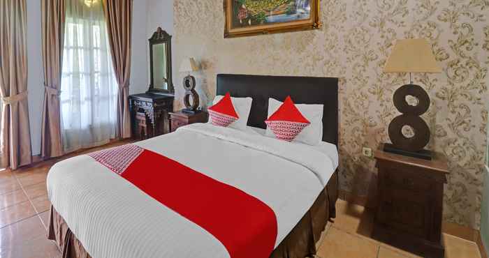 ห้องนอน OYO 113500 Hotel R Cantika Syariah