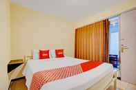 ห้องนอน OYO 90575 Tamtama Guest House