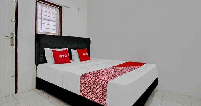 Bedroom OYO 90571 Dewi Guest House Syariah