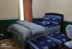 침실 7 Homestay Hanum