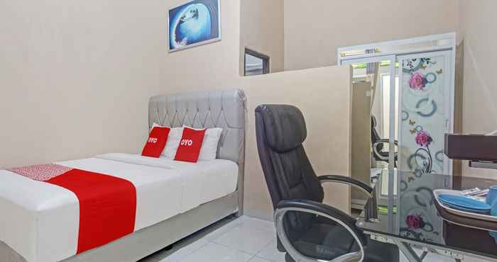 Kamar Tidur OYO 90602 Guest House Marisa Syariah