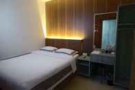 ห้องนอน J & L Inn Semarang