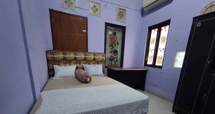 Phòng ngủ OYO 90633 Graha Dirham Homestay