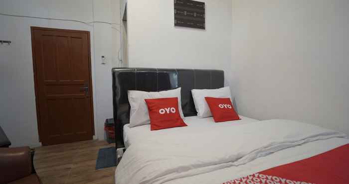 ห้องนอน OYO 90645 Karisma Residence