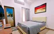 Kamar Tidur 7 OYO 90336 Sungai Rengit City Resort 1