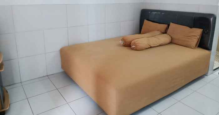 Kamar Tidur OYO 90663 Valencia Kost