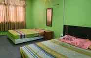 Kamar Tidur 3 OYO HOME 90325 Au Homestay