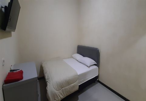 침실 OYO 90677 Polbangtan Syariah Guest House