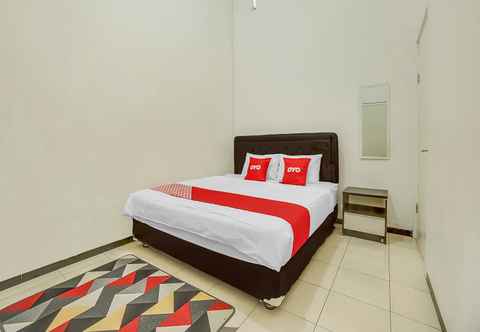 Bedroom OYO 90684 Happy Homestay Syariah