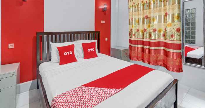 ห้องนอน OYO 90687 Maharatu Homestay